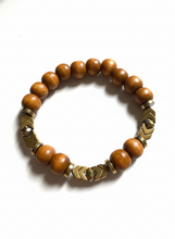 FRTB07- 7.5" elasticated bracelet with dyed wood and gold plated hematite details