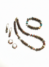 FRTB03 - Coconut, Gold plated hematite, semi precious stone chips and crystal details make this elasticated bracelet